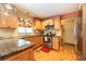 Well-lit kitchen features stainless steel appliances and granite countertops at 3066 19Th Sw Pl, Largo, FL 33774