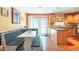 Bright eat-in kitchen showcasing booth seating, stainless steel appliances, and lovely wood cabinetry at 3066 19Th Sw Pl, Largo, FL 33774