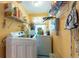 Laundry room with front load washer and dryer, shelves and storage at 3066 19Th Sw Pl, Largo, FL 33774