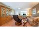 Cozy living room boasting wood-look floors, a ceiling fan, and ample seating at 3066 19Th Sw Pl, Largo, FL 33774