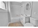 A clean bathroom featuring a shower-tub combo, vanity, and tiled floor at 3409 N 10Th St, Tampa, FL 33605