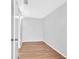 The bedroom is spacious with wood plank flooring and a door to the hallway at 3409 N 10Th St, Tampa, FL 33605