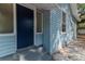 Inviting entryway of light blue home featuring well-maintained siding, number 3409, and a clean aesthetic at 3409 N 10Th St, Tampa, FL 33605