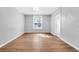 Spacious living room with hardwood floors and ample natural light from a large window at 3409 N 10Th St, Tampa, FL 33605