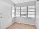 Cozy sun room with tiled floors and lots of natural light from the surrounding windows at 3409 N 10Th St, Tampa, FL 33605