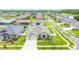 An aerial view of a single-Gathering home featuring a well-manicured lawn and three-car garage at 3503 Gaviota Dr, Sun City Center, FL 33573
