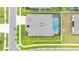 Stunning aerial view of a home with a private screened-in pool and well-maintained landscaping at 3503 Gaviota Dr, Sun City Center, FL 33573