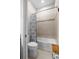 A well-maintained bathroom features a shower-over-tub combo and neutral tiling at 3503 Gaviota Dr, Sun City Center, FL 33573
