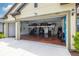Spacious garage with epoxy flooring, extra storage shelving, and ample room for vehicles and projects at 3503 Gaviota Dr, Sun City Center, FL 33573