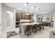 Gourmet kitchen with an oversized island, stainless steel appliances, and modern lighting fixtures at 3503 Gaviota Dr, Sun City Center, FL 33573