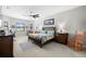 Spacious main bedroom featuring neutral colors, a ceiling fan, and lots of natural light creating a serene and inviting space at 3503 Gaviota Dr, Sun City Center, FL 33573