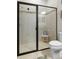 Close-up of bathroom shower showing glass enclosure, tile surround, and bench at 3503 Gaviota Dr, Sun City Center, FL 33573
