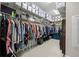 Spacious walk-in closet equipped with shelves and rods for optimal organization at 3503 Gaviota Dr, Sun City Center, FL 33573