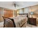 Inviting bedroom with patterned bedding, side tables with lamps, closet, and neutral-toned walls at 3514 Truman Dr, Holiday, FL 34691
