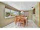 Sunlit dining room featuring a classic wooden table and chairs, ideal for Gathering meals at 3514 Truman Dr, Holiday, FL 34691