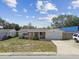 Charming single-story home featuring a one car garage and covered front porch at 3514 Truman Dr, Holiday, FL 34691