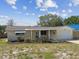 Charming single-story home featuring a one car garage and covered front porch at 3514 Truman Dr, Holiday, FL 34691