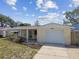 Charming single-story home featuring a one car garage and covered front porch at 3514 Truman Dr, Holiday, FL 34691
