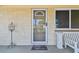 Charming front door with a glass insert, decorative accents, and a 'welcome' mat at 3514 Truman Dr, Holiday, FL 34691