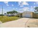 Charming single-story home with a well-manicured front yard and a spacious driveway leading to an attached garage at 3514 Truman Dr, Holiday, FL 34691