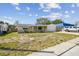 Well-maintained single-Gathering home with an attached garage and a covered front porch at 3514 Truman Dr, Holiday, FL 34691