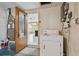 Laundry room with a washer, dryer, and shelving at 3514 Truman Dr, Holiday, FL 34691