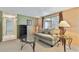 Inviting living room features a plush sofa, and glass tables perfect for relaxation and entertaining at 3514 Truman Dr, Holiday, FL 34691