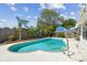 Private backyard in-ground pool area with a patio deck and mature landscaping at 3514 Truman Dr, Holiday, FL 34691