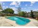 Backyard in-ground private pool with mature landscaping and patio deck area at 3514 Truman Dr, Holiday, FL 34691