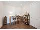 Cozy bar area featuring a wooden table with seating, wine storage, and ample lighting, ideal for entertaining guests and relaxation at 4405 Barletta Ct, Wesley Chapel, FL 33543