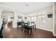 Dining room with windows featuring plantation shutters, a stylish light fixture and elegant decor, perfect for Gathering gatherings at 4405 Barletta Ct, Wesley Chapel, FL 33543