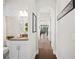 Bright hallway displaying modern archways, neutral paint, beautiful tile, and leading into a sun-filled living space at 4405 Barletta Ct, Wesley Chapel, FL 33543