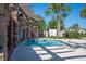 Inviting hot tub area with a waterfall feature and lush landscaping, offering a tranquil and private escape at 4405 Barletta Ct, Wesley Chapel, FL 33543