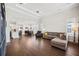 Spacious living room showcasing an open floor plan with hardwood floors, and modern furniture at 4405 Barletta Ct, Wesley Chapel, FL 33543
