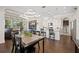 Bright, open-concept living space, showcasing the modern dining area, kitchen, and living room with lots of natural light at 4405 Barletta Ct, Wesley Chapel, FL 33543
