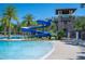 Resort-style pool features a thrilling water slide, tower, and inviting lounging areas with clear blue skies above at 4405 Barletta Ct, Wesley Chapel, FL 33543