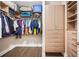 Well-organized walk-in closet featuring built-in shelving, drawers, and hanging space for efficient storage solutions at 4405 Barletta Ct, Wesley Chapel, FL 33543