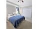 Spacious bedroom with neutral carpeting, ceiling fan, and tray ceiling at 5154 Brickwood Rise Dr, Wimauma, FL 33598