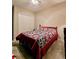 Bedroom with neutral colored carpet and walls with a large closet at 5154 Brickwood Rise Dr, Wimauma, FL 33598