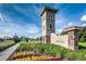 Community entrance with stone accents, decorative landscaping and signage at 5154 Brickwood Rise Dr, Wimauma, FL 33598