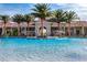 Community pool with fountains and lounge chairs for relaxing by the pool at 5154 Brickwood Rise Dr, Wimauma, FL 33598
