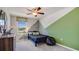 Unique bedroom boasts modern colors, a ceiling fan, a window, and a comfy bed at 5527 Warrington Town Path, Wesley Chapel, FL 33545