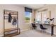 Bright office area features a desk, window with a view, and storage rack at 5527 Warrington Town Path, Wesley Chapel, FL 33545