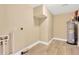 Unfinished basement featuring sturdy flooring, ample space, and a water heater at 602 Stephens Rd, Ruskin, FL 33570