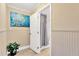 Inviting half bathroom features wainscoting and a shower, accented by an artistic wall hanging at 602 Stephens Rd, Ruskin, FL 33570