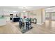 Bright dining area with modern lighting, table, and an open layout to the kitchen at 602 Stephens Rd, Ruskin, FL 33570