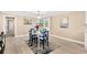Cozy dining area with a table setting and easy access to other living spaces at 602 Stephens Rd, Ruskin, FL 33570