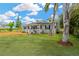 Inviting single-story home with a cozy front porch, beautiful landscaping, and well-maintained lawn at 602 Stephens Rd, Ruskin, FL 33570