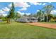 Inviting exterior with a well-manicured lawn, complementing the freshly painted facade at 602 Stephens Rd, Ruskin, FL 33570
