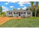 Charming single-story home with a welcoming front porch and well-manicured lawn at 602 Stephens Rd, Ruskin, FL 33570